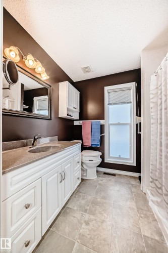 Bathroom featuring vanity and a shower with curtain - 4 Harriott Court, St. Albert, AB - Indoor Photo Showing Kitchen