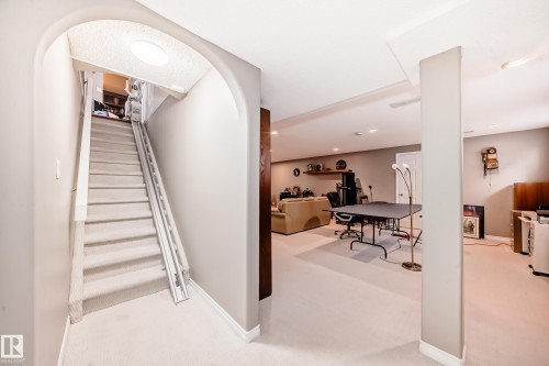 Stairs featuring carpet floors, recessed lighting, and arched walkways - 4 Harriott Court, St. Albert, AB - Indoor Photo Showing Other Room
