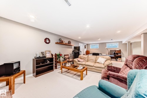 Living area featuring light colored carpet and recessed lighting - 4 Harriott Court, St. Albert, AB - Indoor Photo Showing Living Room
