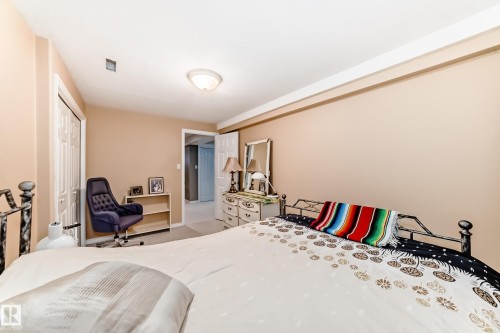 Bedroom featuring a closet and carpet flooring - 4 Harriott Court, St. Albert, AB - Indoor Photo Showing Bedroom