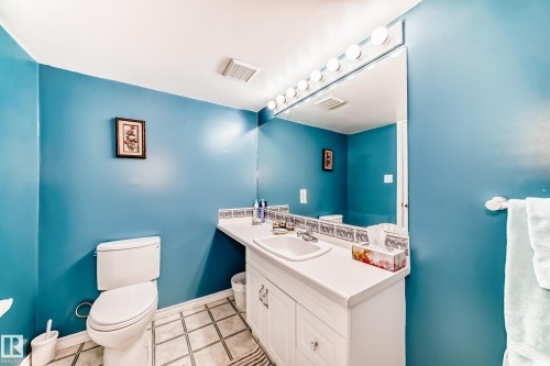 Bathroom with vanity and light tile patterned floors - 4 Harriott Court, St. Albert, AB - Indoor Photo Showing Bathroom