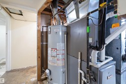 Utilities featuring heating unit and water heater - 