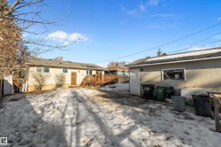 Rear view of house with stucco siding - 