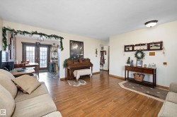 Living area with wood tiled floors and french doors - 