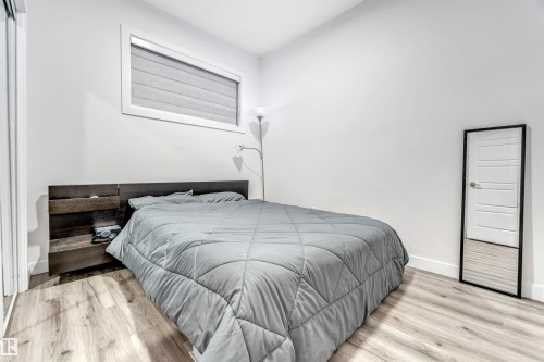Bedroom featuring light wood finished floors and baseboards - 1522 17 Avenue, Edmonton, AB - Indoor Photo Showing Bedroom