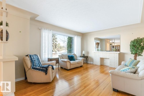 Living Room with Large North Facing Window - 8707 Strathearn Drive, Edmonton, AB - Indoor Photo Showing Living Room