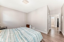 Bedroom featuring baseboards and wood finished floors - 