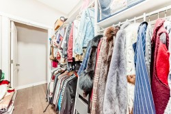Walk in closet featuring light wood-style floors - 