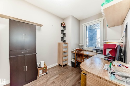 Office area featuring light wood-style flooring and baseboards - 7719 Getty Wynd, Edmonton, AB - Indoor