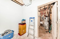 Utilities with gas water heater and electric panel - 