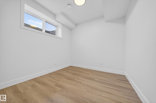 Spare room with light wood-style flooring - 436 Crystal Creek Link, Leduc, AB - Indoor Photo Showing Other Room
