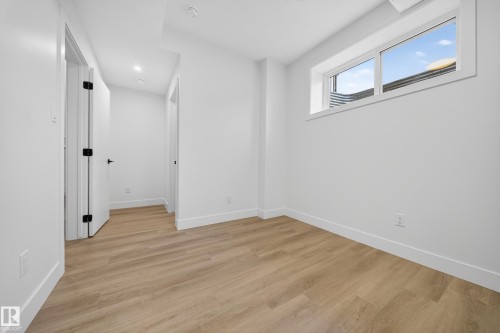 Spare room featuring light wood-style flooring and recessed lighting - 436 Crystal Creek Link, Leduc, AB - Indoor Photo Showing Other Room