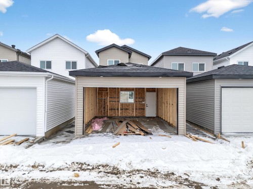 View of snow covered garage - 436 Crystal Creek Link, Leduc, AB - Outdoor