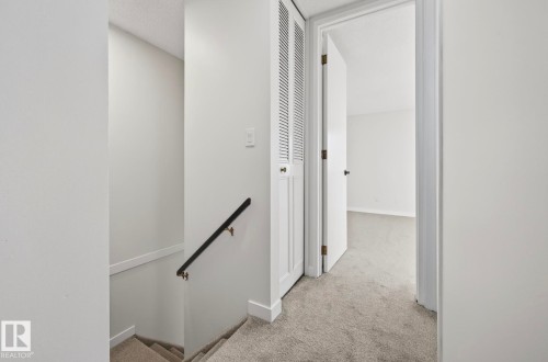 Corridor with an upstairs landing and light colored carpet - 9969 171 Ave, Edmonton, AB - Indoor Photo Showing Other Room