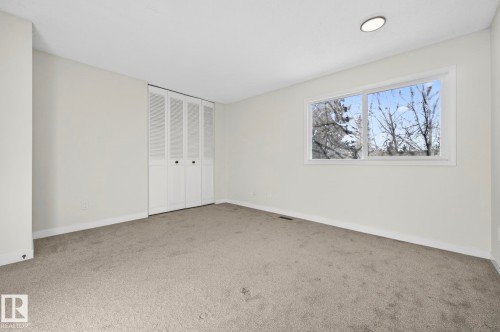 Unfurnished bedroom featuring light carpet and a closet - 9969 171 Ave, Edmonton, AB - Indoor Photo Showing Other Room