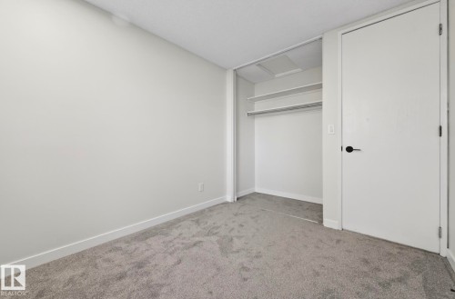 Unfurnished bedroom featuring light colored carpet and a closet - 9969 171 Ave, Edmonton, AB - Indoor Photo Showing Other Room