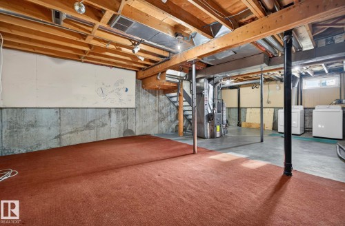 Below grade area featuring washer / clothes dryer, heating unit, and water heater - 9969 171 Ave, Edmonton, AB - Indoor Photo Showing Basement