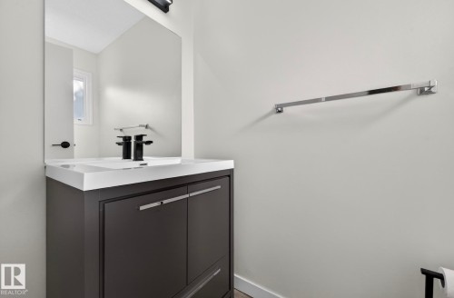 Bathroom with vanity and baseboards - 9969 171 Ave, Edmonton, AB - Indoor Photo Showing Bathroom