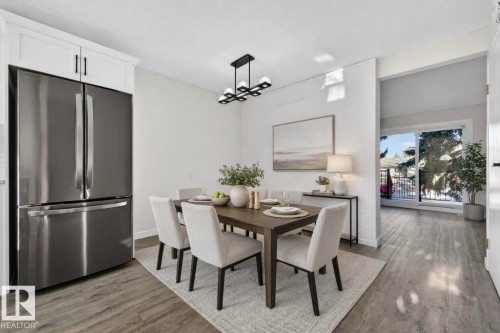 Dining area with light wood-style floors and baseboards - 9969 171 Ave, Edmonton, AB - Indoor Photo Showing Dining Room