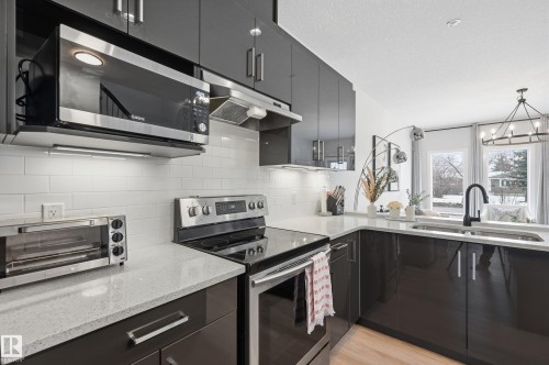 10736 149 Street, Edmonton, AB - Indoor Photo Showing Kitchen With Stainless Steel Kitchen With Double Sink With Upgraded Kitchen