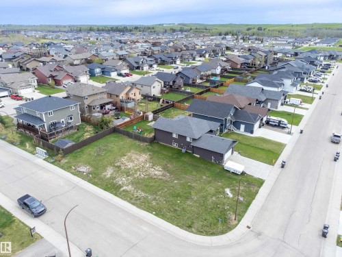 Cleared corner lot featuring a partial fence and curb cut - 4930 57 Avenue, Cold Lake, AB 