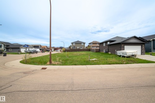 Expansive corner lot featuring a level, grassed area and direct street access - 4930 57 Avenue, Cold Lake, AB 