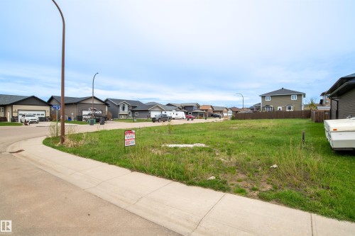 Expansive residential lot featuring a level, grassy terrain - 4930 57 Avenue, Cold Lake, AB 