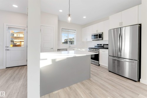 560 Glenridding Ravine Drive Sw, Edmonton, AB - Indoor Photo Showing Kitchen With Upgraded Kitchen