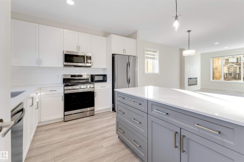 560 Glenridding Ravine Drive Sw, Edmonton, AB - Indoor Photo Showing Kitchen With Upgraded Kitchen