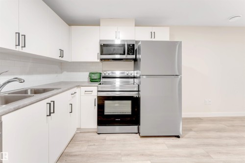 560 Glenridding Ravine Drive Sw, Edmonton, AB - Indoor Photo Showing Kitchen With Double Sink