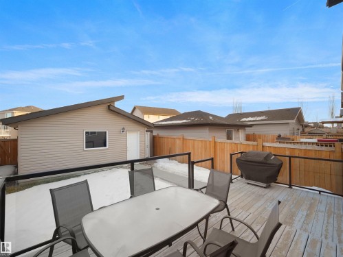 Wooden terrace with outdoor dining space, a fenced backyard, and area for grilling - 5423 Chappelle Road, Edmonton, AB - Outdoor With Deck Patio Veranda With Exterior