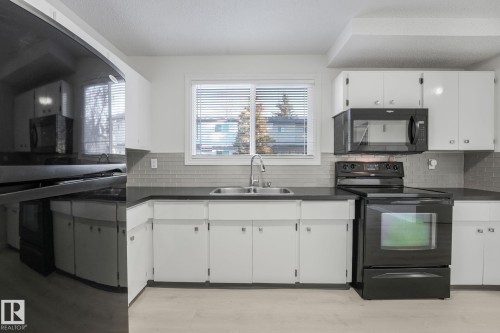 2625 135 Avenue, Edmonton, AB - Indoor Photo Showing Kitchen With Double Sink