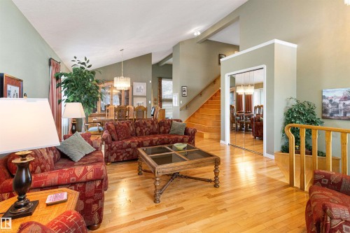 Living room with hanging lights, light wood finished floors, and lofted ceiling - 519 Buchanan Road, Edmonton, AB - Indoor Photo Showing Living Room