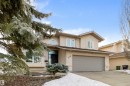 Traditional-style house featuring stucco siding, a garage, and concrete driveway - 519 Buchanan Road, Edmonton, AB  - Outdoor With Facade 