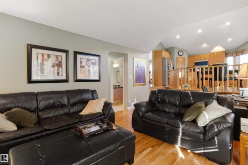 Living area featuring vaulted ceiling, light wood-type flooring, and recessed lighting - 519 Buchanan Road, Edmonton, AB - Indoor Photo Showing Living Room