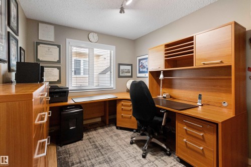 Office space with a textured ceiling and rail lighting - 519 Buchanan Road, Edmonton, AB - Indoor Photo Showing Office