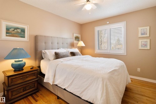 Bedroom with light wood finished floors, a ceiling fan, and a textured ceiling - 519 Buchanan Road, Edmonton, AB - Indoor Photo Showing Bedroom