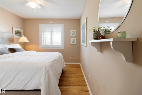 Bedroom with light wood-style floors and a ceiling fan - 519 Buchanan Road, Edmonton, AB - Indoor Photo Showing Bedroom