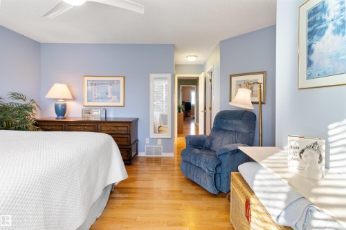 Bedroom with light wood-style flooring and ceiling fan - 519 Buchanan Road, Edmonton, AB - Indoor Photo Showing Bedroom