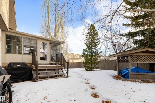 Snowy yard featuring a sunroom and a fenced backyard - 519 Buchanan Road, Edmonton, AB - Outdoor