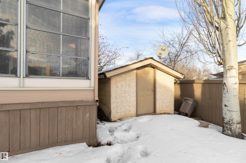 Snow covered structure featuring a storage shed - 519 Buchanan Road, Edmonton, AB - Outdoor With Exterior