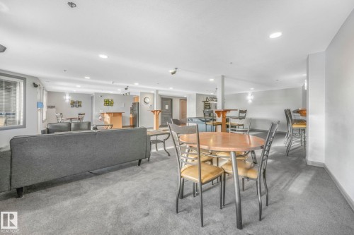 Carpeted dining space with recessed lighting and baseboards - 415 530 Hooke Road, Edmonton, AB - Indoor