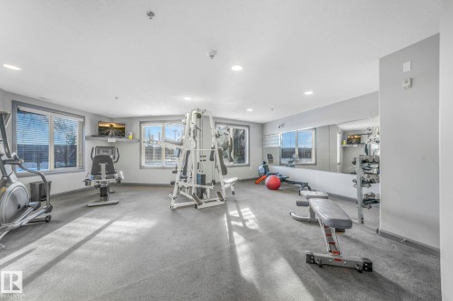 Gym featuring recessed lighting - 415 530 Hooke Road, Edmonton, AB - Indoor Photo Showing Gym Room