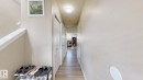 Hallway featuring a textured ceiling and light wood finished floors - 1150 37B Avenue, Edmonton, AB  - Indoor Photo Showing Other Room 