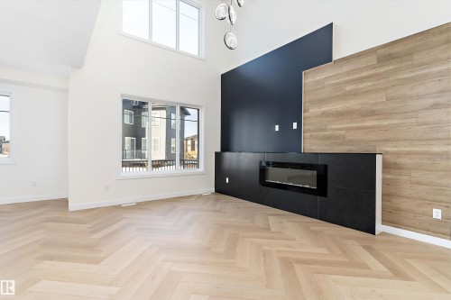 8916 Mayday Way, Edmonton, AB - Indoor Photo Showing Other Room With Fireplace