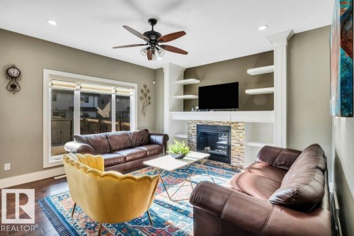 3235 16 Avenue, Edmonton, AB - Indoor Photo Showing Living Room With Fireplace