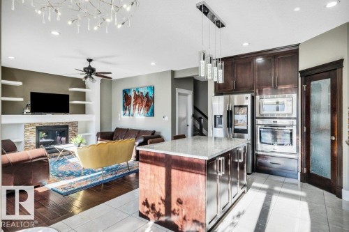 3235 16 Avenue, Edmonton, AB - Indoor Photo Showing Kitchen With Fireplace