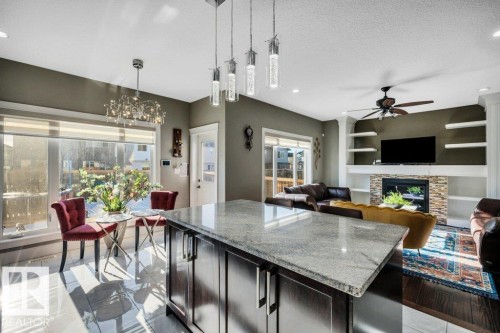 3235 16 Avenue, Edmonton, AB - Indoor Photo Showing Kitchen With Fireplace