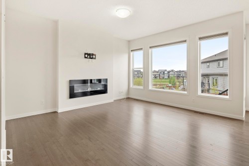 5404 22 Avenue, Edmonton, AB - Indoor Photo Showing Living Room With Fireplace