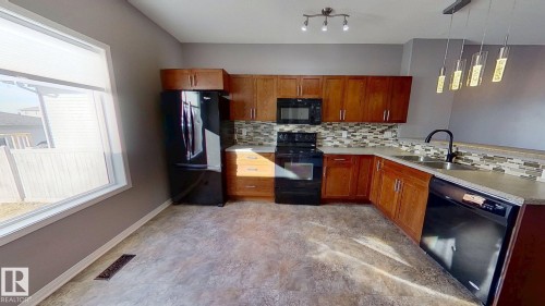 222 Schubert Street, Leduc, AB - Indoor Photo Showing Kitchen With Double Sink